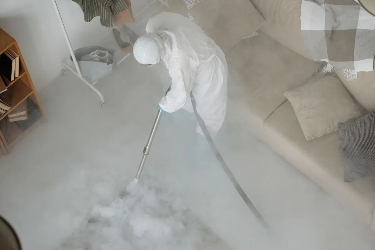 Biohazard cleanup technician in protective equipment, Perry, UT